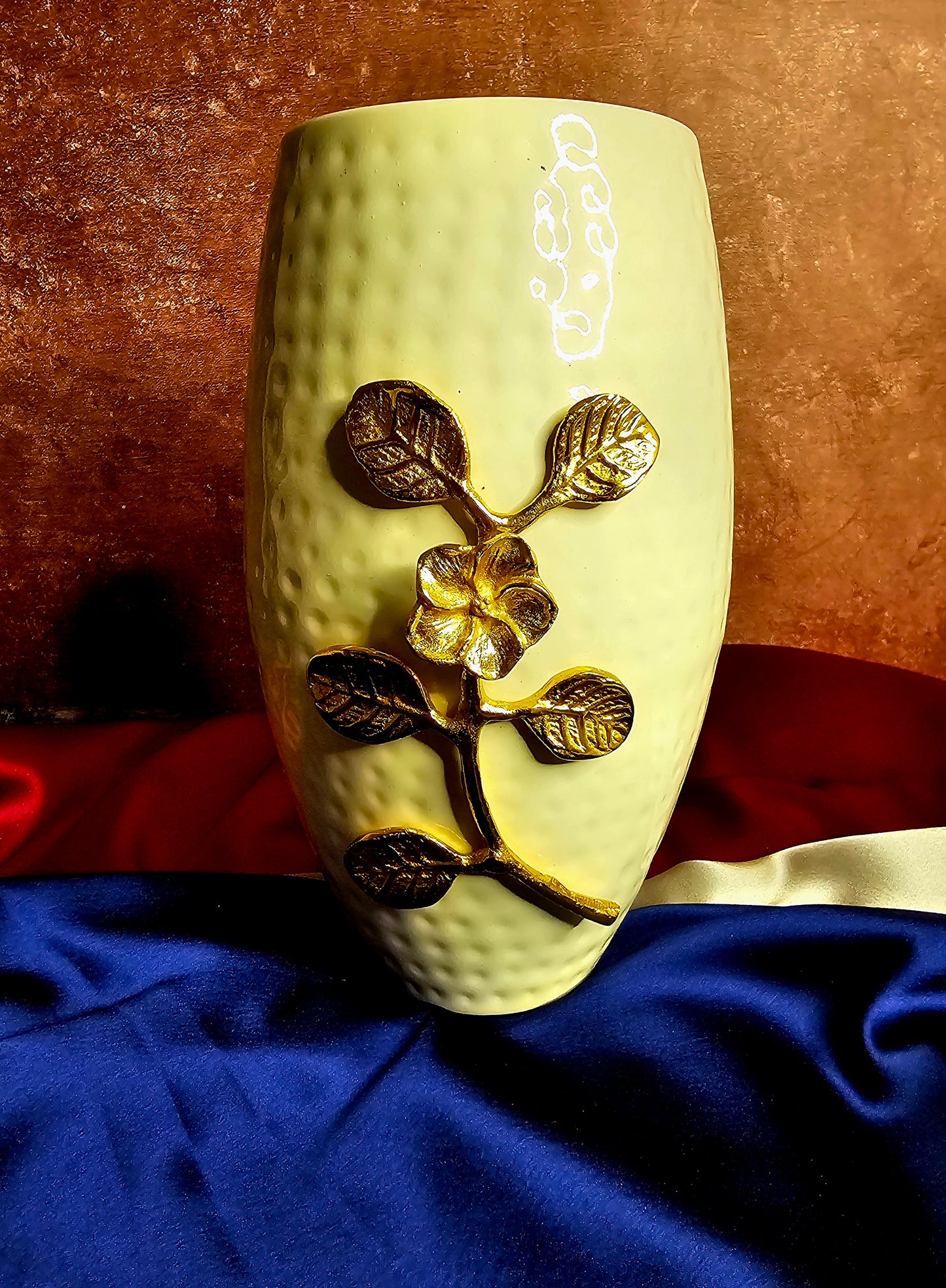 White vase with golden flower embellishments