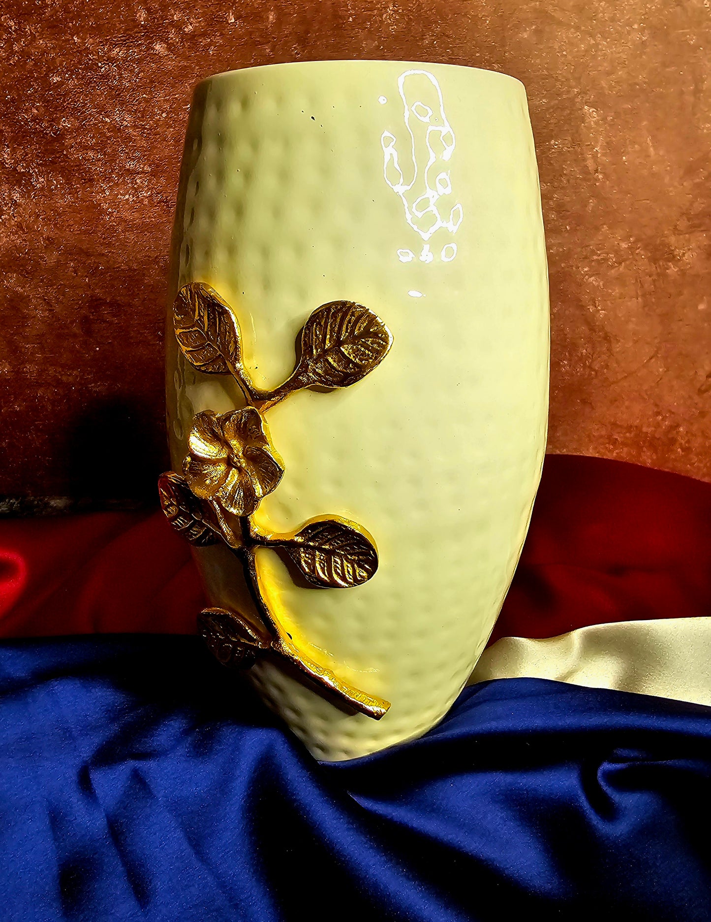 White vase with golden flower embellishments