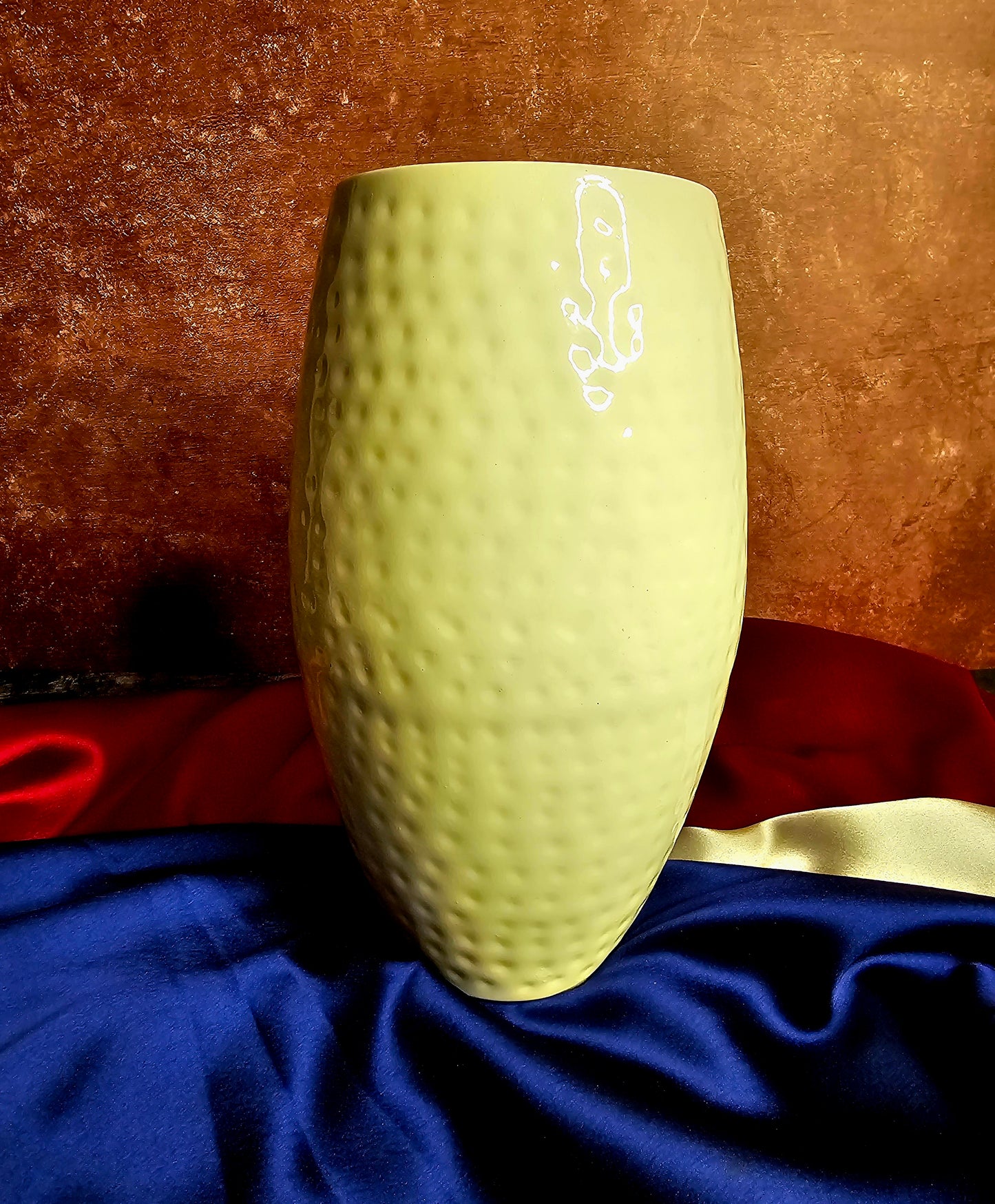 White vase with golden flower embellishments