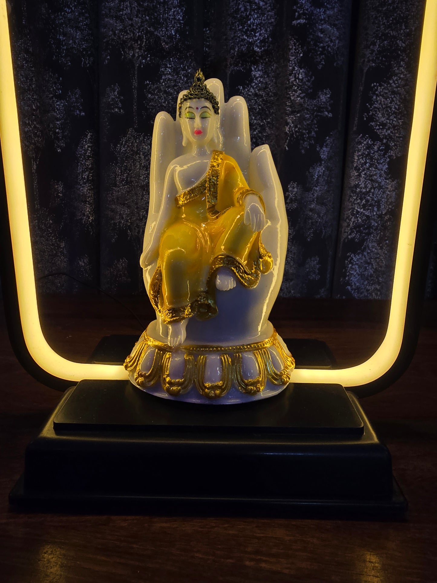 Palm Buddha with light